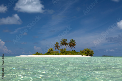 Fototapeta Naklejka Na Ścianę i Meble -  Small Lovely Desert Island in Maldives. Dreamlike Travel Destination.