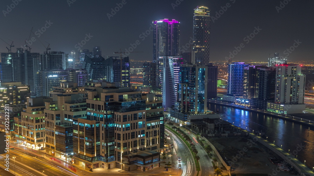 Bay Square district night timelapse with mixed use and low rise complex office buildings located in Business Bay in Dubai