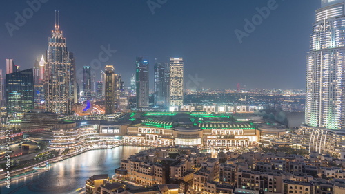 Aerial view of Dubai International Financial Centre district day to night timelapse