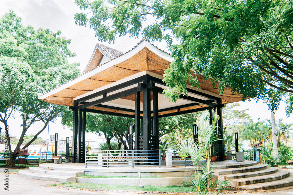 A Chinese-style kiosk surrounded by trees, A park with a Japanese-style kiosk, concept of a small Japanese temple A Chinese-style kiosk surrounded by trees, A park with a Japanese-style kiosk, concept of a small Japanese temple