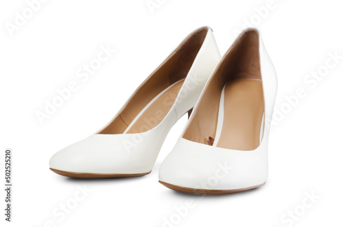 Classic snow-white bride shoes made of genuine leather with high elegant heels, isolated on a white background.