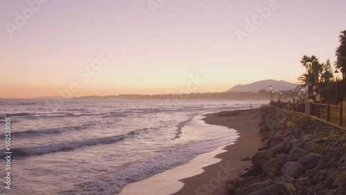 Beautiful beach next to the Mediterranean Sea at sunset. Marbella, Spain