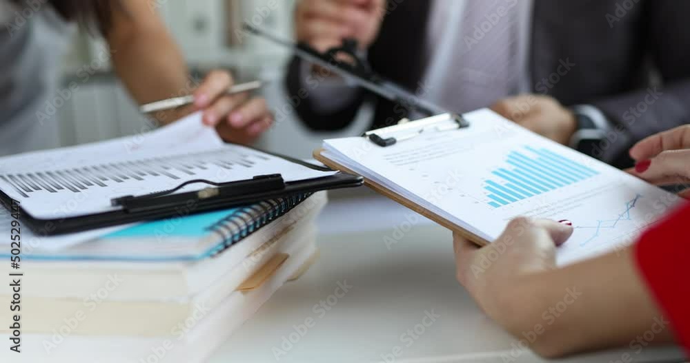 Business team is studying financial analytics in marketing Business team is studying financial analytics in marketing