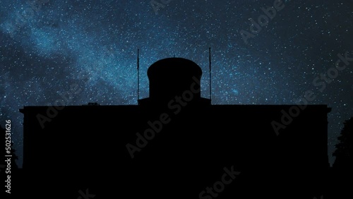 Skyline of State Capitol Building by Night, Time Lapse with Stars Milky Way in Background and Statehouse Dome in Silhouette, USA photo