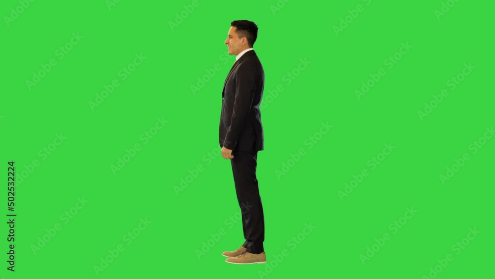 Rich boss in suit, ethnic business owner or entrepreneur show thumb up, point finger at you smiling on a Green Screen, Chroma Key. Rich boss in suit, ethnic business owner or entrepreneur show thumb up, point finger at you smiling on a Green Screen, Chroma Key.