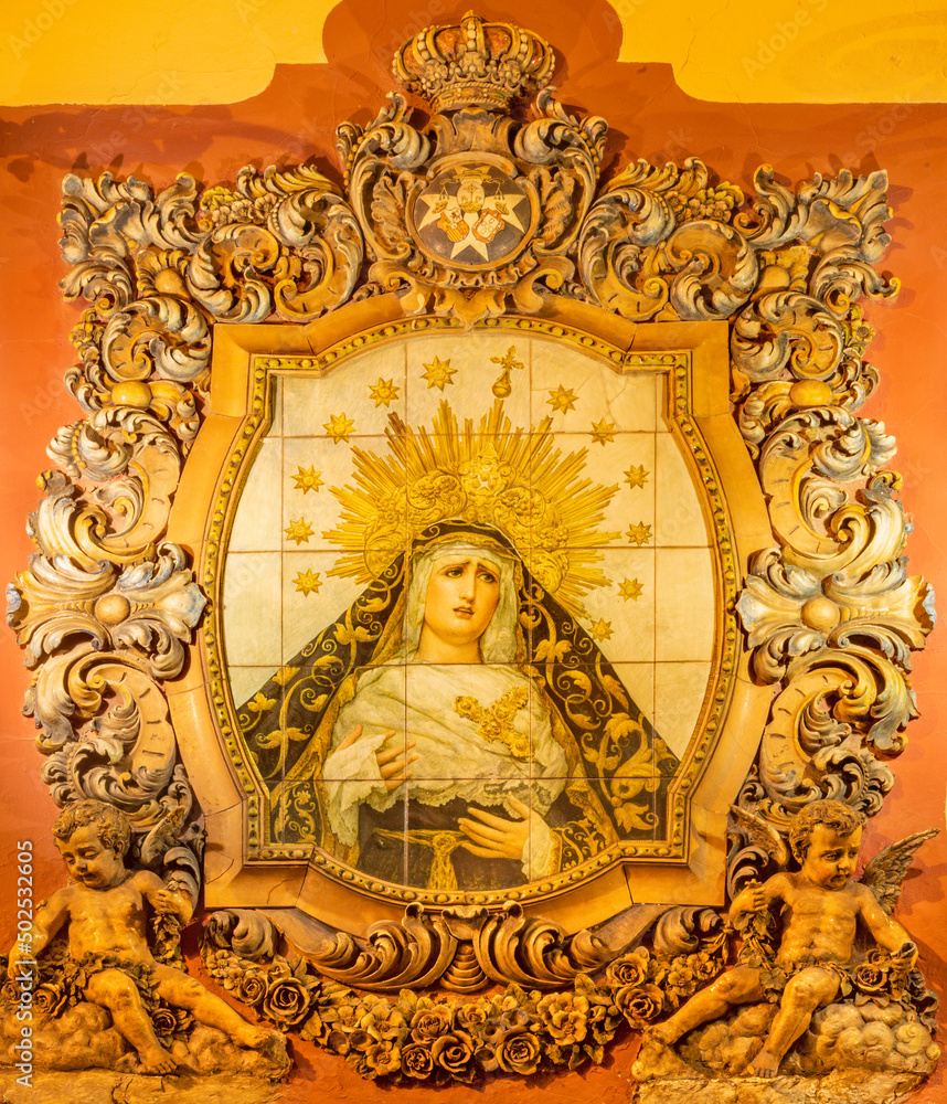 SEVILLE, SPAIN - OCTOBER 29, 2014: The ceramic tiled, cried Madonna on the facade of church Iglesia San Bonaventura by Enrique Orce Marmol (1951).