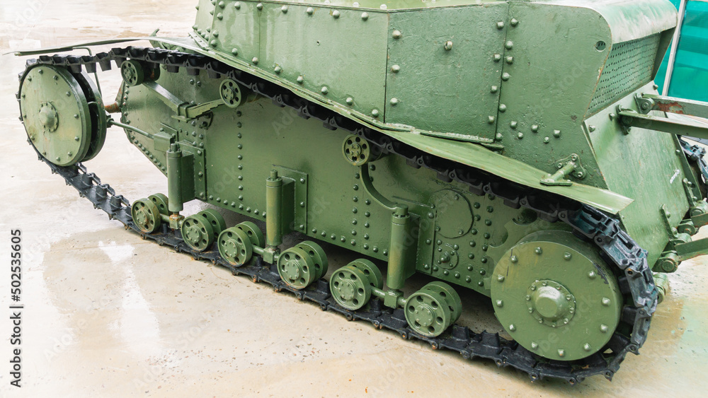 Chassis and suspension of an old tracked tank. Old armored vehicles. Tracked tank with riveted hull and turret. A rare instance of a tank. Chassis and suspension of an old tracked tank. Old armored vehicles. Tracked tank with riveted hull and turret. A rare instance of a tank.