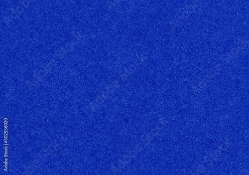 High detail uncoated bright dark royal blue paper texture background close-up scan with rough fiber grain pattern for paper material mockup or presentation wallpaper with copy space for text