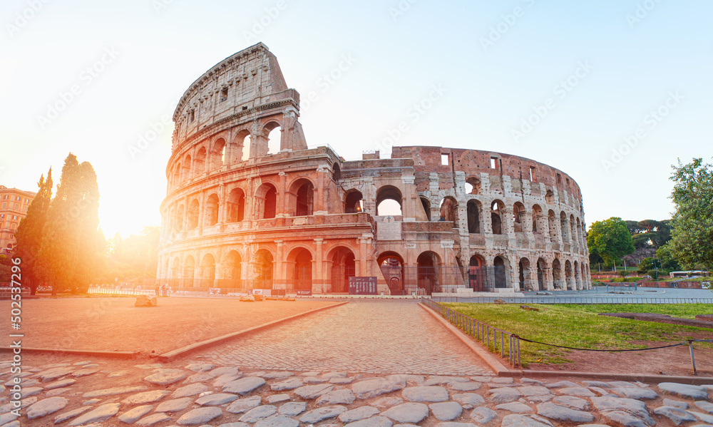 Colosseum in Rome at amazing sunset or sunrise - Colosseum is the  best famous known architecture and landmark in Rome, Italy