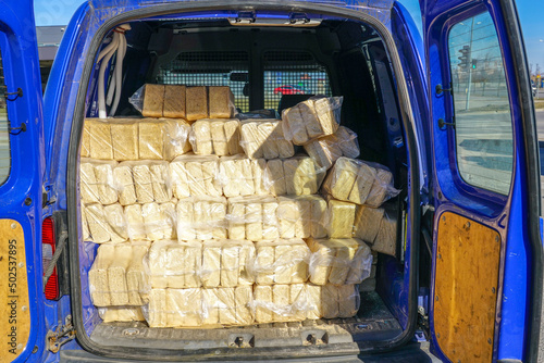 Packaged wood sawdust briquettes loaded in a car, biofuel with good heat output photo