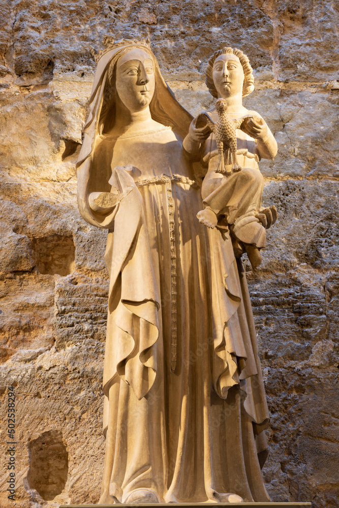 VALENCIA, SPAIN - FEBRUAR 14, 2022: The stone statue of Madonna in the Cathedral - Basilica of the Assumption of Our Lady  by unknown artist of 14. cent.