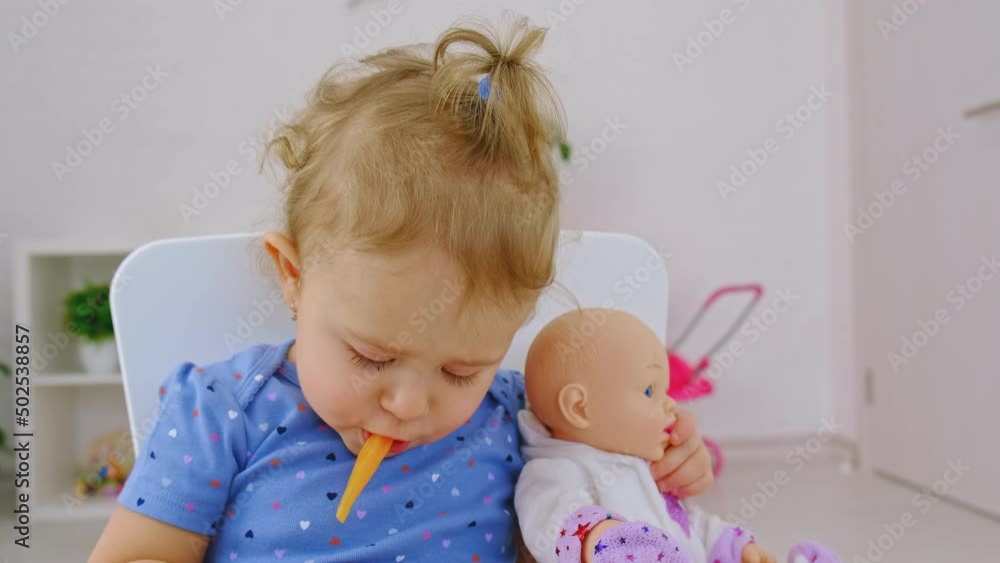 The child eats pasta and vegetables. Selective focus. The child eats pasta and vegetables. Selective focus.