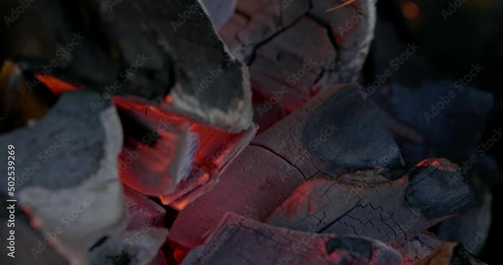 Close-up coal burn in the fire in slow motion. Coal is starting to burn. Super Slow motion video. Close-up coal burn in the fire in slow motion. Coal is starting to burn. Super Slow motion video.