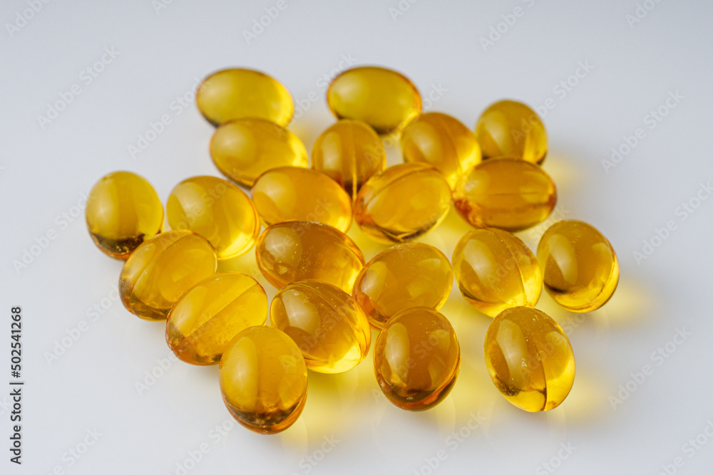 fish oil in omega 3 capsules on a white background fish oil in omega 3 capsules on a white background