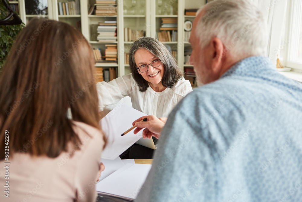 Seniors and tax consultant discuss contract Seniors and tax consultant discuss contract