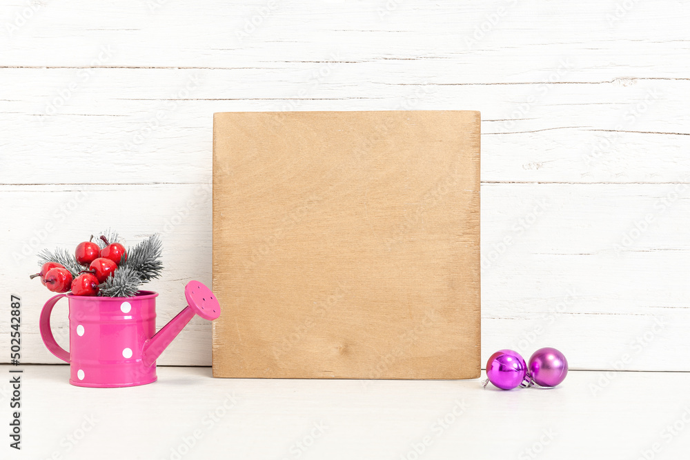 Square wooden sign with balls and fir branches. Square wooden sign with balls and fir branches.