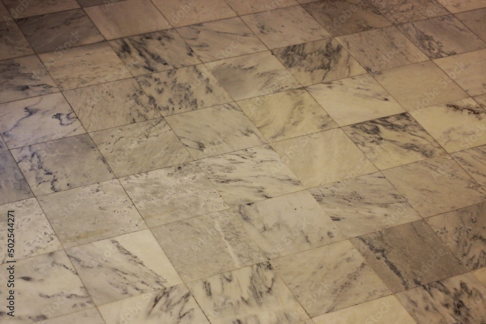 Obraz premium Vintage marble floor made of square tiles.
