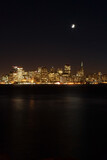 the skyline of San Francisco and moon at night