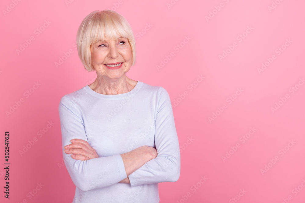 Photo of retired pretty lady folded hands wonder thoughtful look empty space isolated over pink color background Photo of retired pretty lady folded hands wonder thoughtful look empty space isolated over pink color background