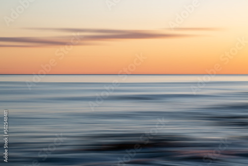 An abstract coastal sunset with intentional blur