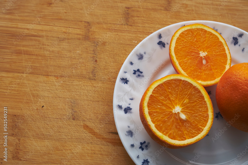 orange on a plate orange on a plate