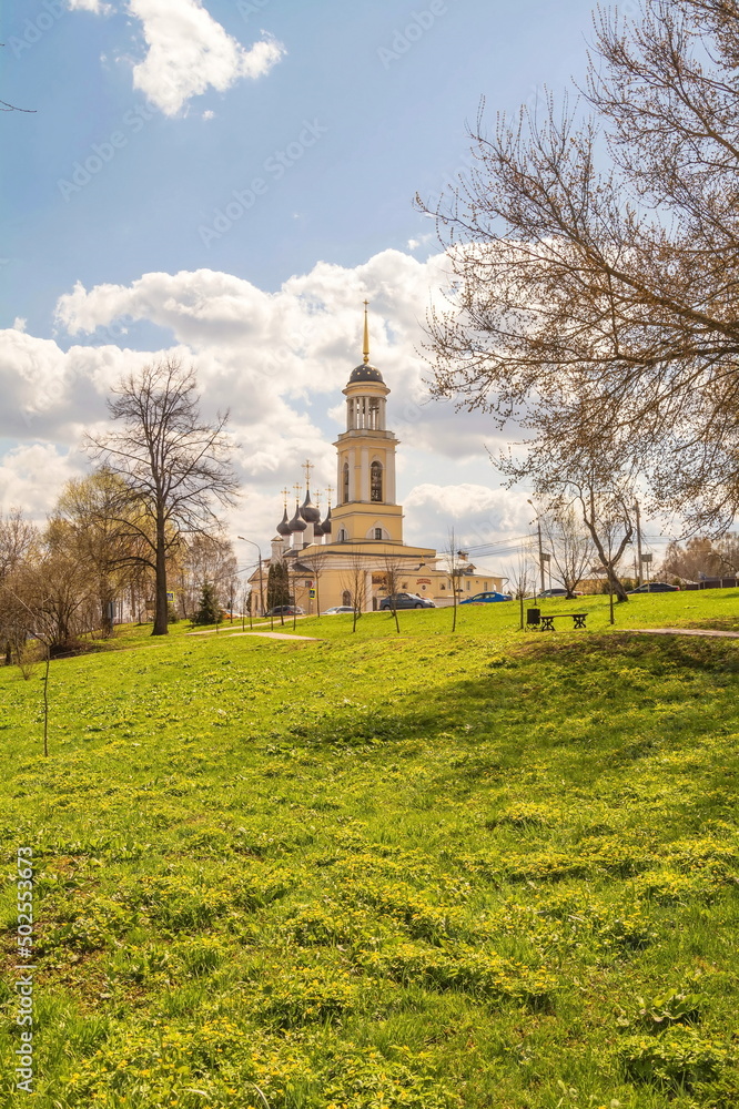 Naklejka premium Russian spring landscape with a temple on a hill