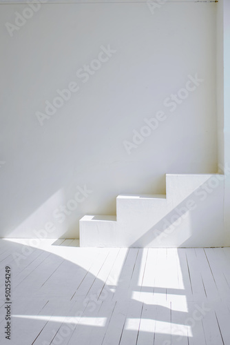 Bright room interior in white tones and sunlight. Interior design.