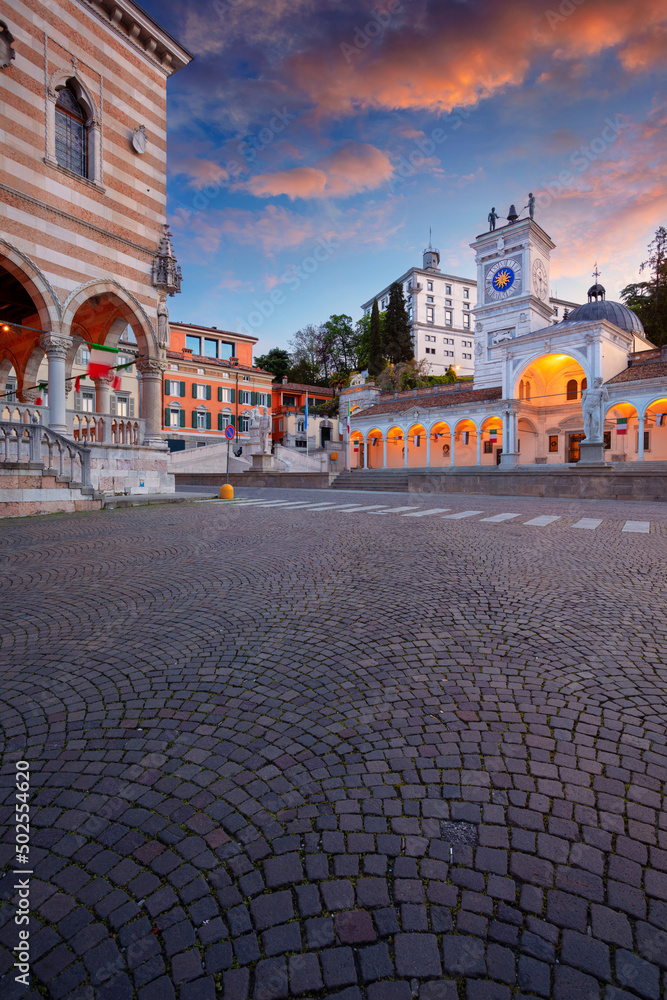 Udine, Italy. Cityscape image of downtown Udine, Italy with town square at sunrise.
