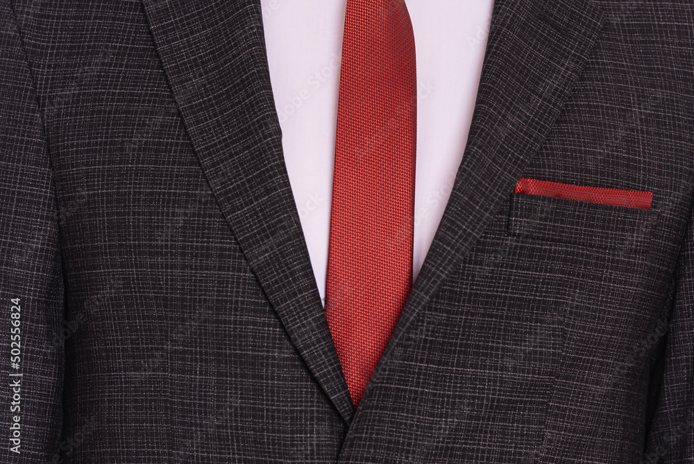 black men's suit and white shirt and red tie, close up black men's suit and white shirt and red tie, close up