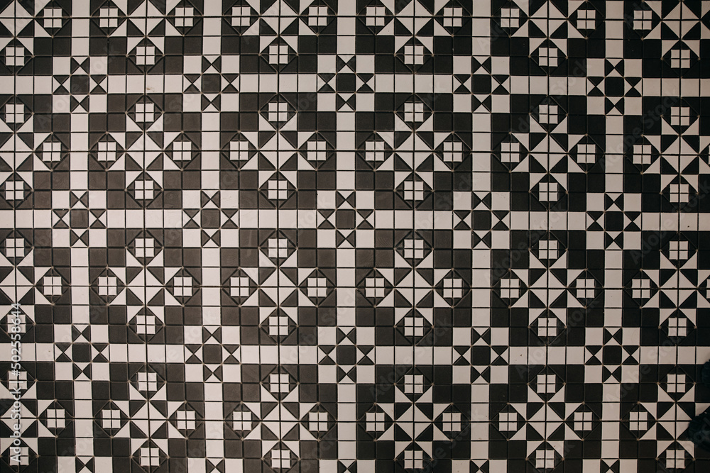 black and white tile pattern on the floor. black and white tile pattern on the floor.