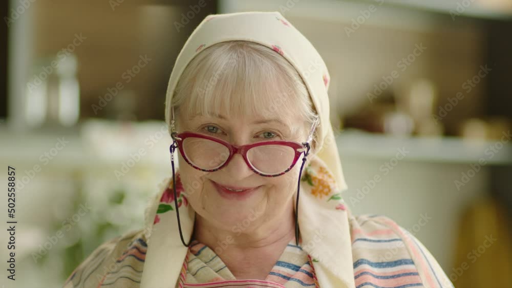 Smiling senior woman wearing headscarf Smiling senior woman wearing headscarf