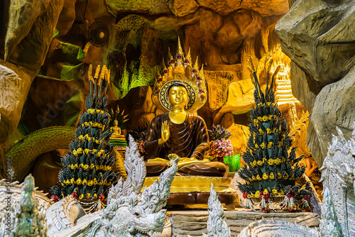 Nakhon Nayok, Thailand - April, 24, 2022 : Angel statue of Maniwong Temple at Nakhon Nayok, Thailand.Naga Cave is enshrines a large Buddha for people to worship. photo