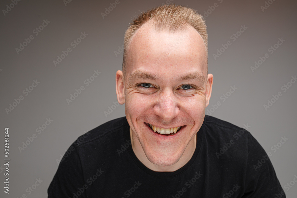 Obraz premium Copy-space photo of cheerful young man with big smile
