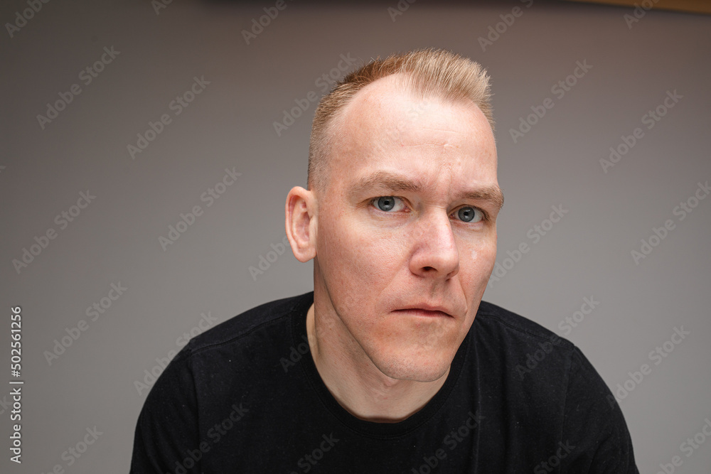 Shocked man with lifted eyebrow.