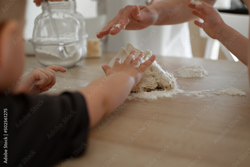 children's hands touching yeast dough children's hands touching yeast dough
