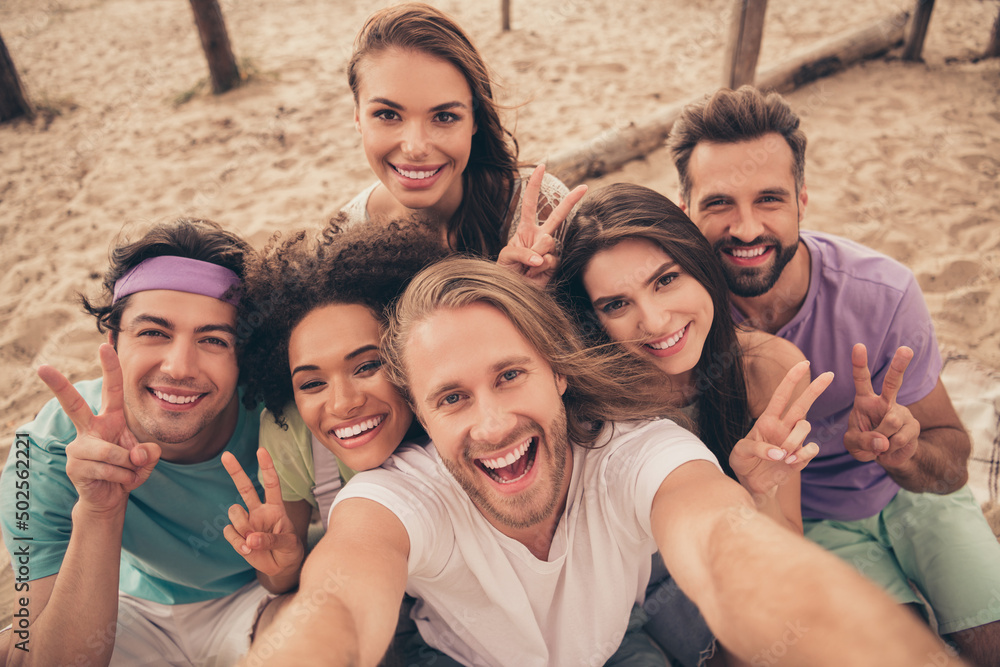 Fototapeta premium Photo of sweet charming young six friends wear casual clothes walking recording self video showing v-signs smiling outside countryside
