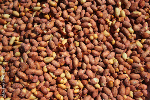 Salty crunchy roasted peanuts as background