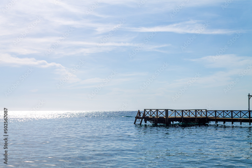 Little girl is playing on the dock. Little girl is playing on the dock.
