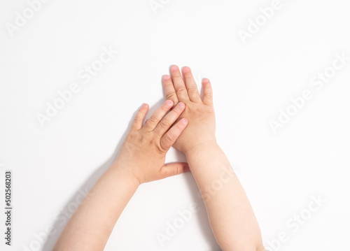 Small child s hands on a white background