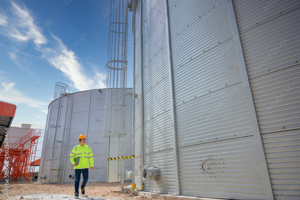 Naklejka premium male engineer working in industrial estate Control, design and production management in the engineering industry. Utilities and utilities Sewers and central wastewater treatment plants