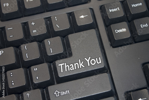 Black Computer Keyboard with Thank You text. Close-up of an electronic Computer Device part, keypad.