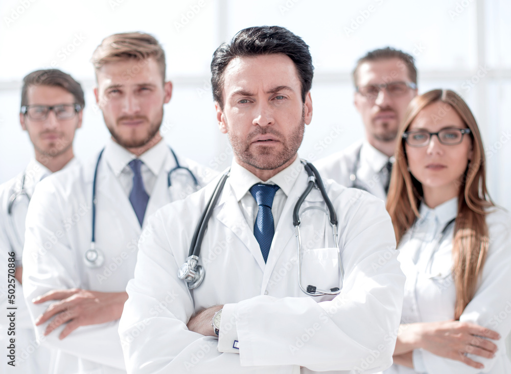 portrait of doctor and medical staff standing in the office portrait of doctor and medical staff standing in the office
