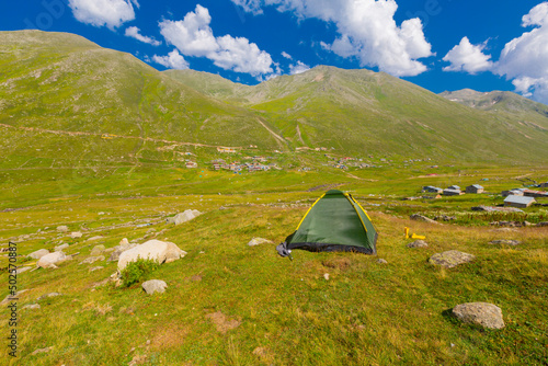 Persembe Plateau in the summer season. Highland houses and sheep grazing in the meadows. The most important Black Sea region travel destinations. Aybasti district, Ordu city, Turkey photo