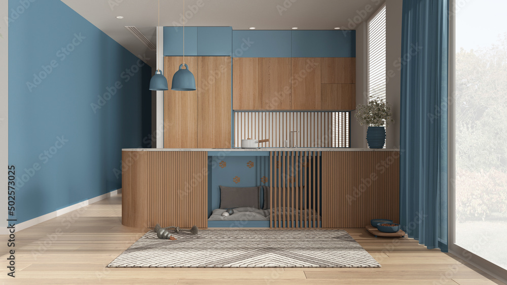 Pet friendly wooden and blue kitchen. Space devoted to pets, dog bed inside furniture with pillows and toys. Carpet, treat bowl, big window with curtains, parquet. Interior design