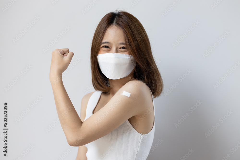 Healthy and happy fully vaccinated asian young woman wearing face mask Healthy and happy fully vaccinated asian young woman wearing face mask