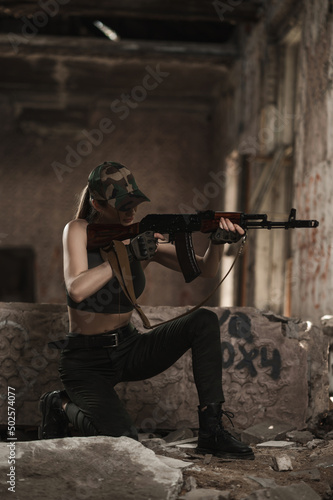 Wallpaper Mural A military girl takes aim while sitting. Ukrainian Women's Army Torontodigital.ca