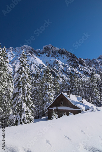 Tatry   stare schronisko nad Morskim Okiem zim  . Tatra Mountains  old shelter at Morskie Oko lake in winter.