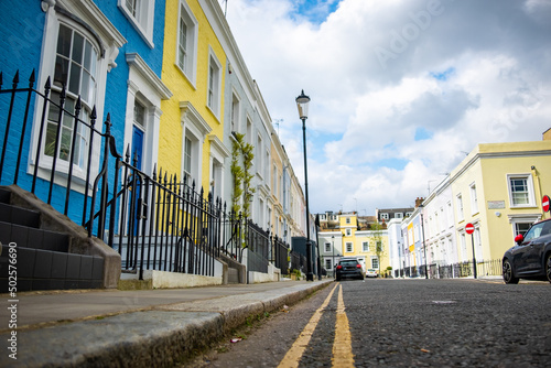 Attractive and colourful London terraced houses in Notting Hill area of Kensington, West London 