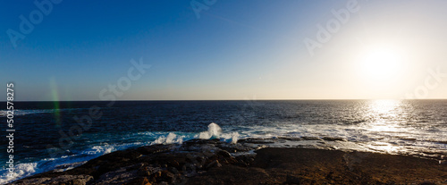 Evening scene on sea  stones  calm ocean