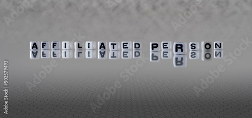 affiliated person word or concept represented by black and white letter cubes on a grey horizon background stretching to infinity